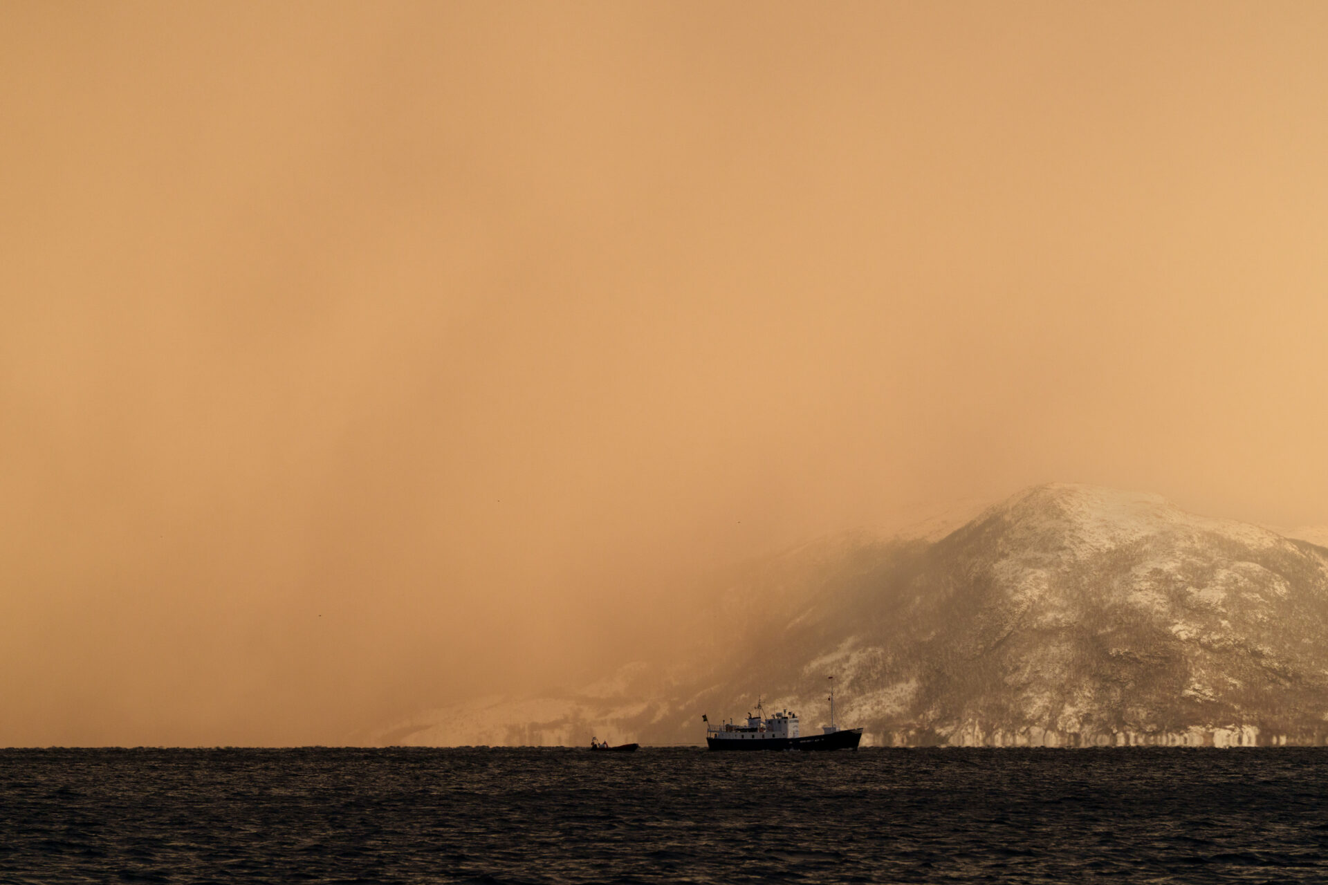 Our boat anchored in the Norwegian fjord